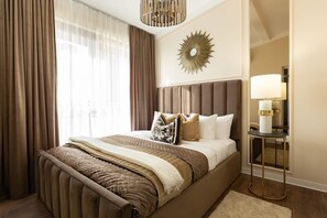 Indulge in lavish comfort in our elegantly furnished bedroom oasis.