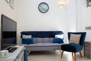 Two seater sofa and armchair. Wall lights