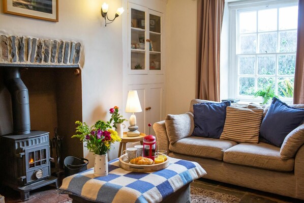 Two seater sofa. Original walls cupboards. Wall lights