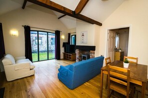 Sofas, large window and fire place