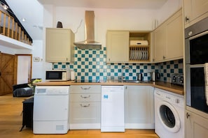 Wall and base cupboards, dishwasher, washing machine and tumble dryer