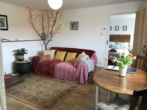 Lounge with sofa, dining table and 2 chairs