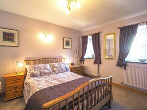 Y Beudy double bedroom with bedside drawers and lamps