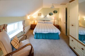 Double bed, large wardrobe with drawers and full length mirror. Occasional chair