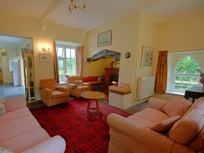 Cosy sitting room with log fire