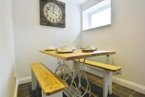 Dining area with table and two bench seats