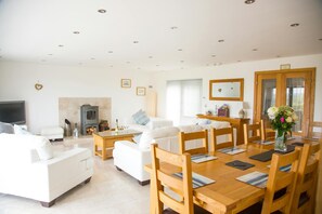 Living room with dining table and chairs, fireplace