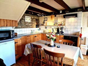 kitchen and dining area with seating for 4