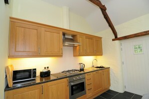 Kitchen area with door to lawn