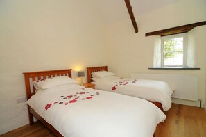 Pretty beamed twin bedroom