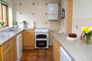 Electric hob and oven, base cupboards and plenty of work surface
