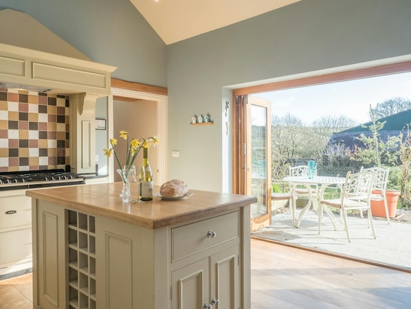 Large bi-fold doors leading from kitchen to patio area