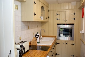 Eye level oven with storage cupboards
