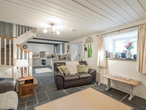 Living area and kitchen, stairs to first floor