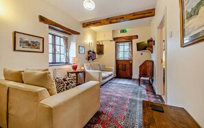 Two sofas and wall mounted TV
