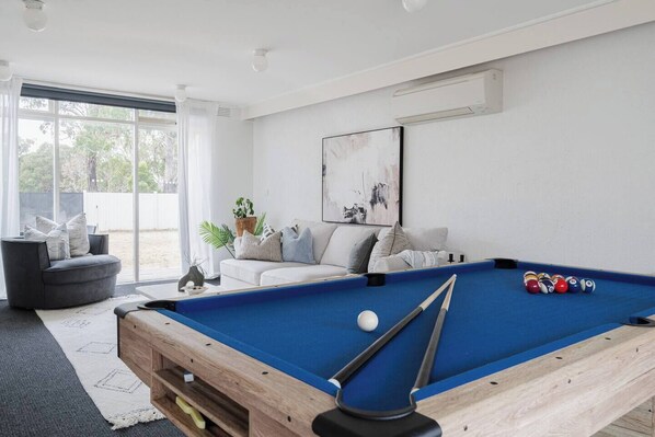 Rack 'em up! Enjoy some friendly competition with a pool table in the living area.