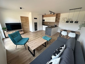 Property, Furniture, Couch, Comfort, Television, Plant, Floor, Flooring, Living Room, Wood