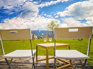 Cloud, Sky, Property, Table, Furniture, Shade, Rectangle, Outdoor Furniture, Plant, Grass