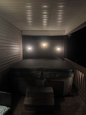 Great ambiance at night...hot tub seats 7