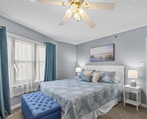 {MASTER BEDROOM} King bed, 50" smart TV and ensuite bathroom with walk in shower