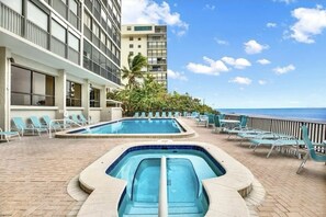 Heated pool along with relaxing Jacuzzi by the beach.