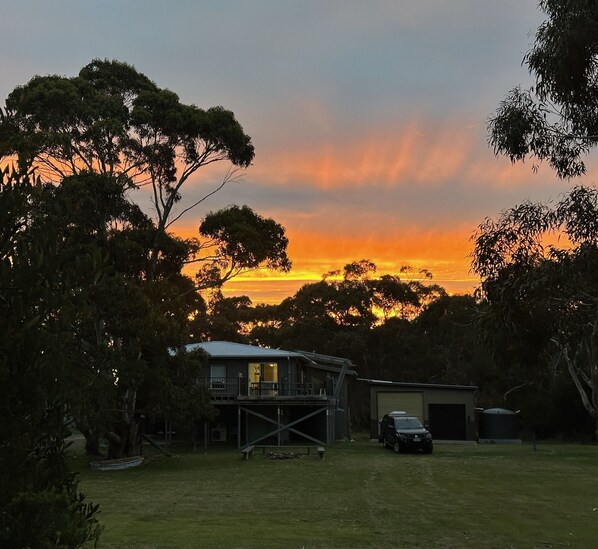 Beautiful sunset behind the house.