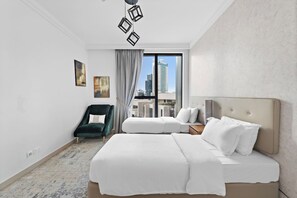 Chic Bedroom Retreat: Enjoy skyline views and stylish decor for your perfect Dubai getaway!
