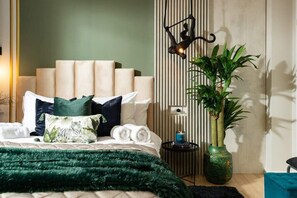 Drift into a restful sleep in our sanctuary of luxury, where attention to detail, cleanliness, and the soothing presence of plants create a serene and inviting atmosphere.