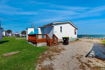 Soundfront manufactured home near beach with private dock, deck, water views, AC