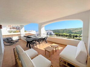 Spacious corner terrace with sea, golf & valley