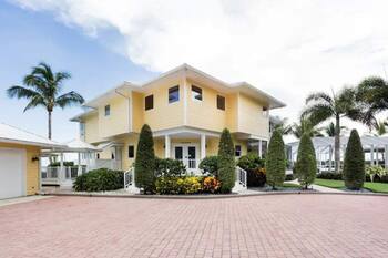 Lush Waterfront Pool Home and Pool house with Pickleball court and Boat dock