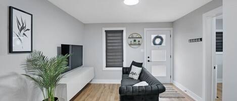 Escape into a world of comfort & relaxation in this bright and cozy family room. The perfect space for quality time with loved ones, socializing and winding down. Sink into the plush seating, make memories or recharge in this inviting welcoming room