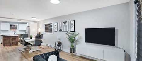 `Stay connected & entertained in our modern family room. Enjoy hi-speed internet & Ethernet for seamless work or play. Binge on your favorite shows & movies with the Smart TV, featuring Netflix, Prime & local Bell TV. Relax & unwind in style.`