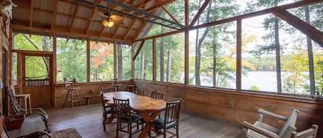 Enormous screened porch overlooks the pond