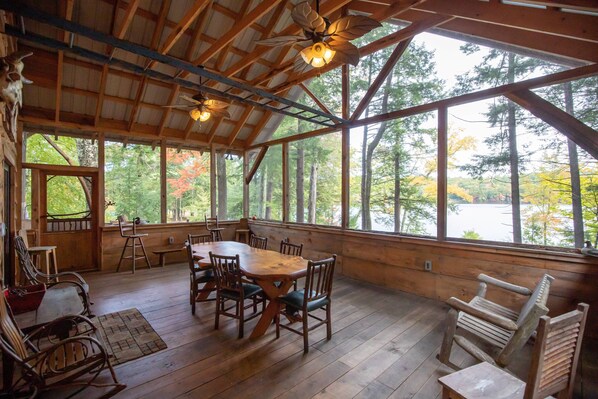 Enormous screened porch overlooks the pond