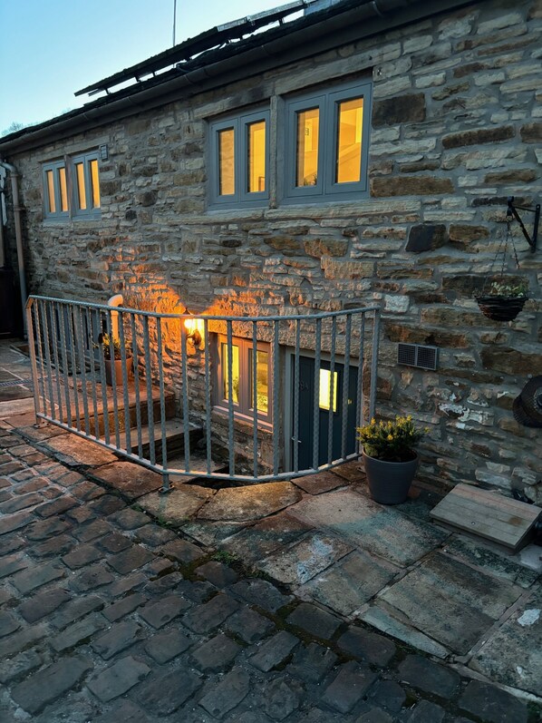 Entrance door down the stone steps