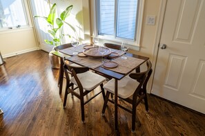 Dining table with full dinnerware available.