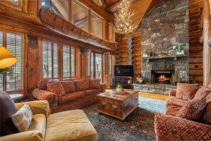 Floor-to-ceiling wood-burning fireplace feature in the main living area.