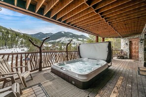 Luxury 13-person hot tub on the back deck with views of the Greywolf golf course & the mountain resort.
