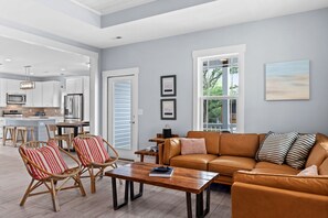 Cozy coastal living room, open floor plan.
