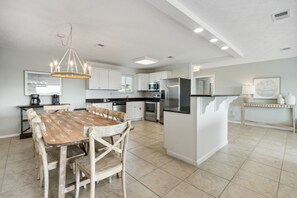 Spacious Kitchen and Dining Area with Seating for Eight at the Table