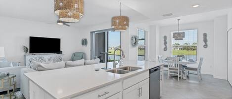 Bright, inviting open living space overlooking pond