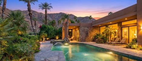Unwind in your private Palm Springs oasis, mountain views, glowing pool, and serene indoor-outdoor living made for unforgettable desert nights.