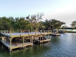 Boat dock has jet ski ramp and Boat lift