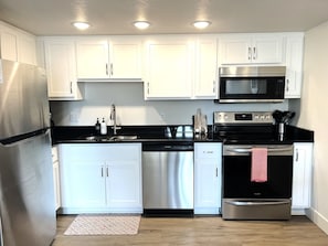 Whip up a delicious meal in the fully equipped kitchen - the heart of your cozy condo that's sure to inspire your inner chef!