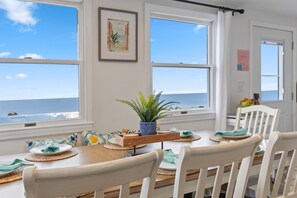 Imagine enjoying a delicious meal with the soothing sound of waves and a breathtaking beach view adding to the tranquility.