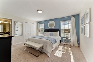 Master bedroom with a comfortable king bed