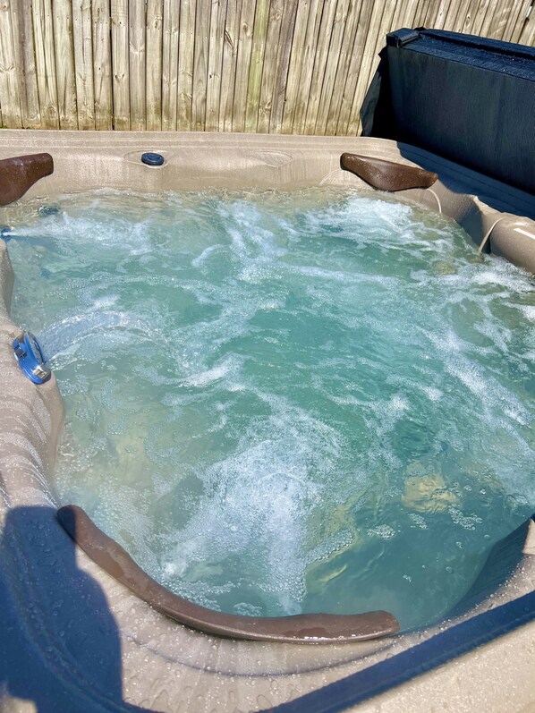 4 person Hot Tub in the back yard.  There is a privacy fence on all sides off the yard.  