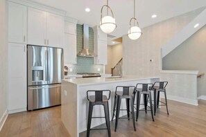 The kitchen is a great space to make meals and stay in for a movie night or to make the perfect Music City cocktail before walking over to Geodis Park to catch a concert.