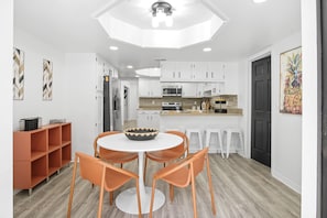 Modern dining room with a bright and functional kitchen